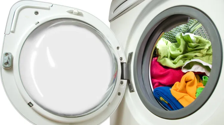a front load washer full of clothing